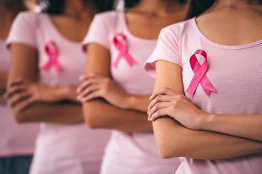Photo of three women with pink shirts and breastcancer ribbon. Photo: Vasyl Dolmatov/iStock images