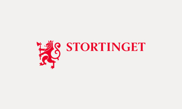Offisiell Stortingets riksvåpen. Rød løve foran teksten Stortinget