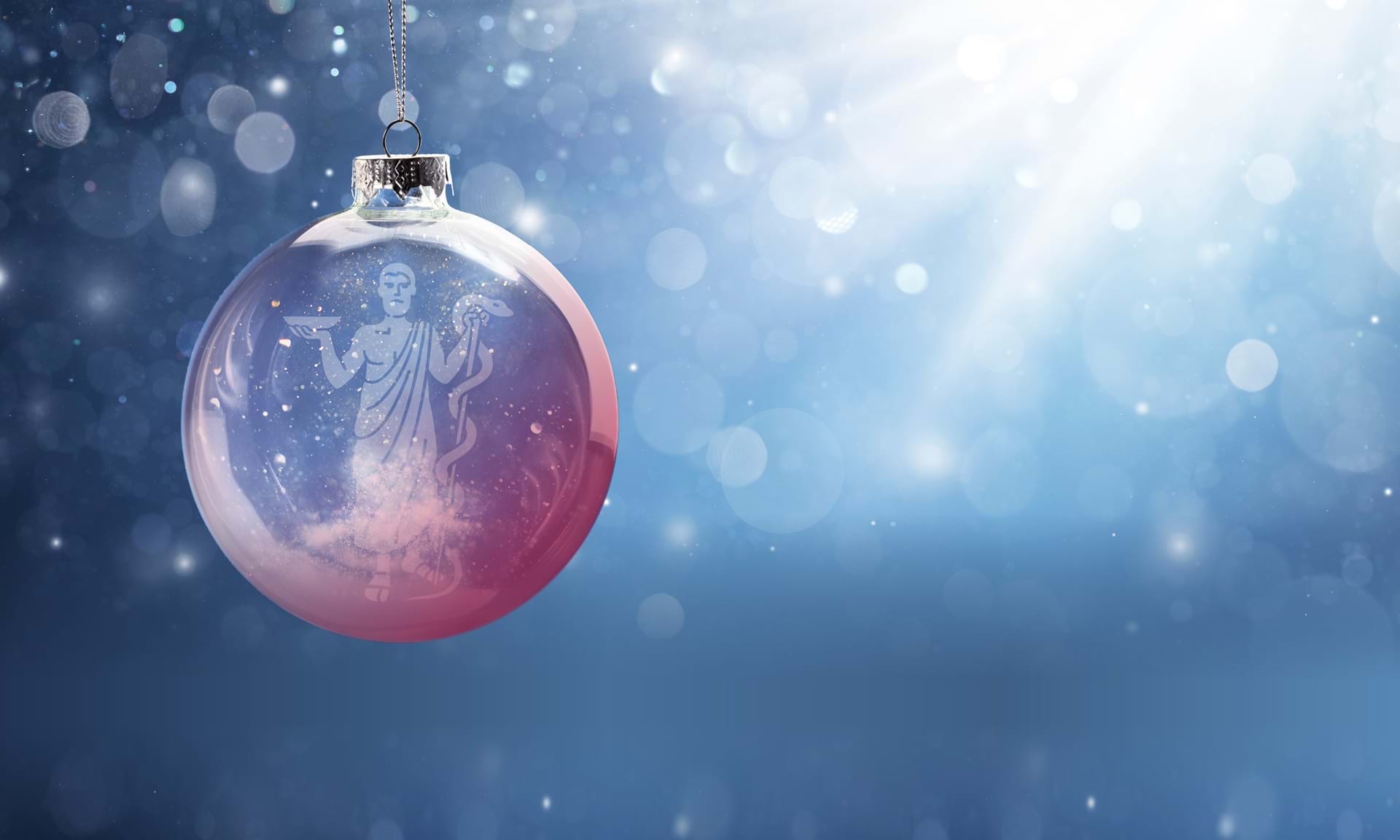 Julekule med Asklepios som henger foran solstr&#229;ler. Foto: Legeforeningen